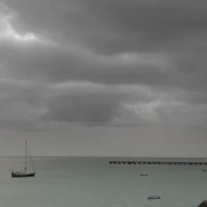 LONELY MAN IN A RAINY LANDSCAPE
